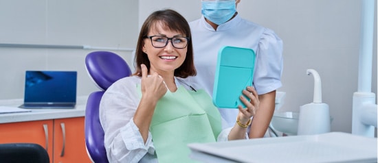 Satisfied Patient With Her Cosmetic And Restorative Dental Procedures