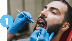 Man getting his teeth checked in Washington Heights