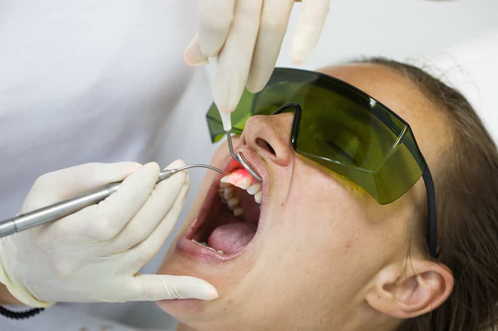 Dentist Using A Modern Diode Dental Laser