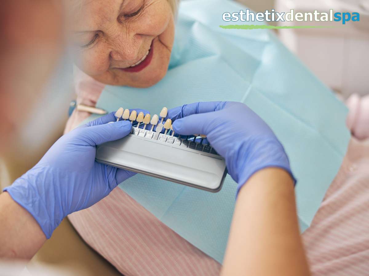Elderly woman smiling during a dental implants color matching session