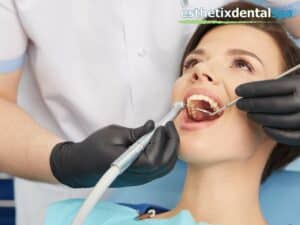 Dentist treating a patient for tooth erosion